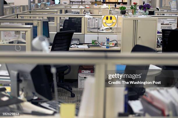 Dozens of empty cubicles occupy space where naval civilians that are federal government employees temporarily left behind, due to the government...