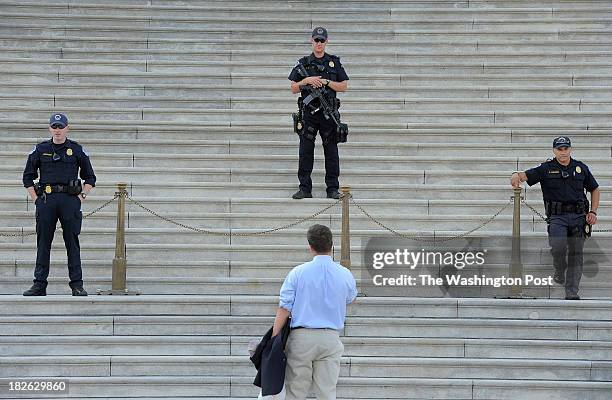 Eric Homan talks to police outside the United States Capitol during the government shutdown on Tuesday October 01, 2013 in Washington, DC.