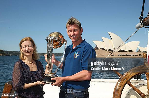 Brett Lee and NSW Minister for Sport Gabrielle Upton pose on Sydney Harbour with the ICC Cricket World Cup trophy during celebrations to mark 500...