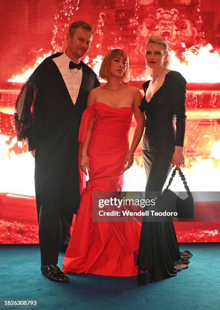 Damien Woolnough, Melissa Leong and Emma Boseley attends the NGV Gala 2023 at the National Gallery of Victoria on December 02, 2023 in Melbourne,...