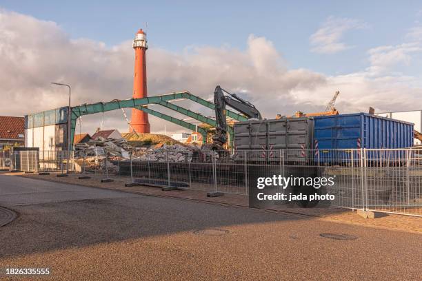 overview of a demolition site cordoned off with steel fences - detriti foto e immagini stock
