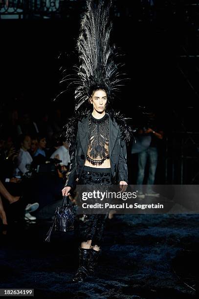 Model walks the runway during Louis Vuitton show as part of the Paris Fashion Week Womenswear Spring/Summer 2014 at Le Carre du Louvre on October 2,...