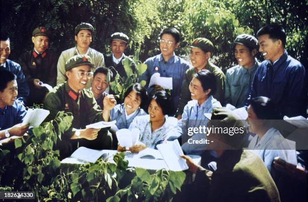 Retouched picture released in 1971 in Beijing by Chinese official news agency showing smiling happy young members of the Red Guards and soldiers...