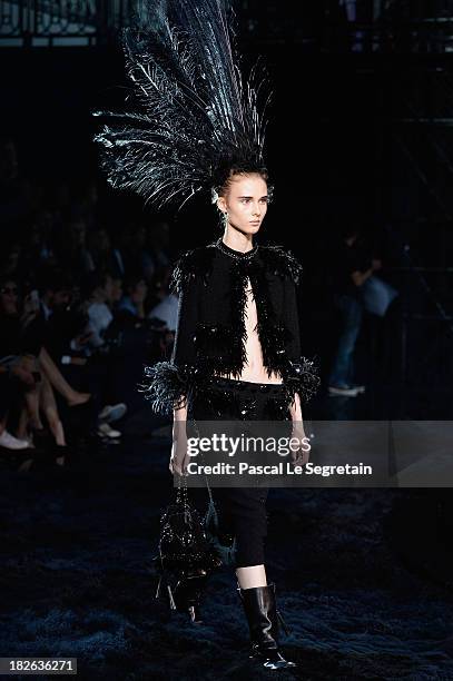 Model walks the runway during Louis Vuitton show as part of the Paris Fashion Week Womenswear Spring/Summer 2014 at Le Carre du Louvre on October 2,...