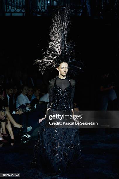 Model walks the runway during Louis Vuitton show as part of the Paris Fashion Week Womenswear Spring/Summer 2014 at Le Carre du Louvre on October 2,...