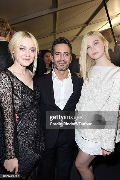 Dakota Fanning, Marc Jacobs and Elle Fanning attend the Louis Vuitton show as part of the Paris Fashion Week Womenswear Spring/Summer 2014 on October...