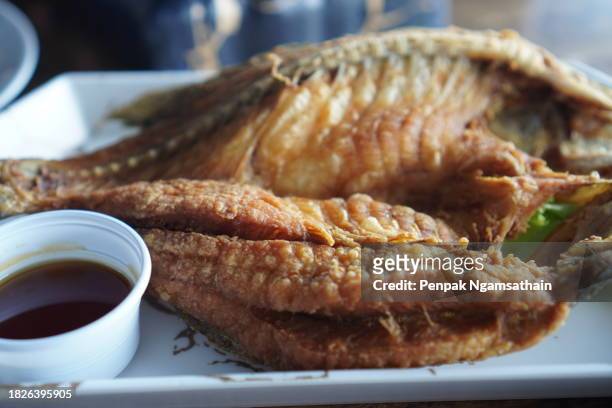 fried snapper with fish sauce - nuoc cham stock pictures, royalty-free photos & images