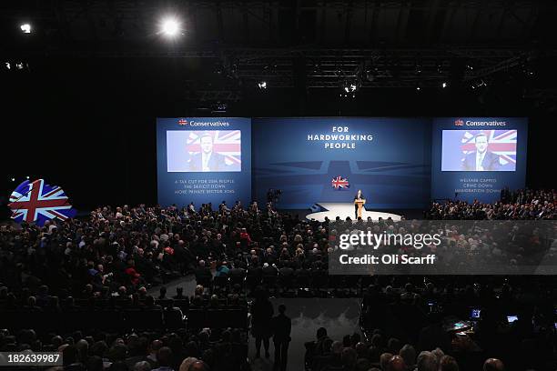 British Prime Minister David Cameron delivers his keynote speech to delegates on the last day of the annual Conservative Party Conference at...