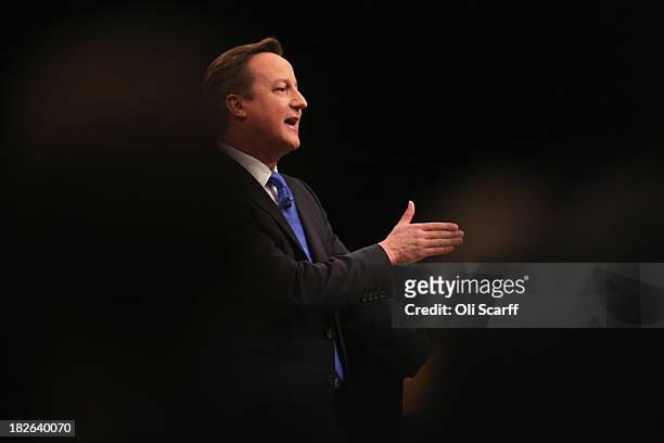 British Prime Minister David Cameron delivers his keynote speech to delegates on the last day of the annual Conservative Party Conference at...