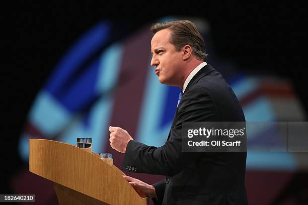 British Prime Minister David Cameron delivers his keynote speech to delegates on the last day of the annual Conservative Party Conference at...