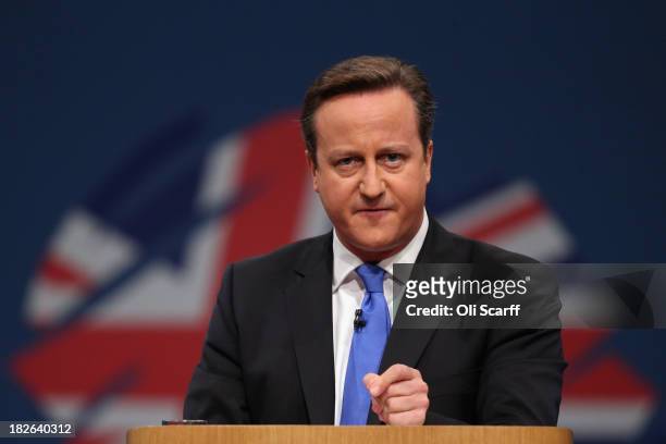 British Prime Minister David Cameron delivers his keynote speech to delegates on the last day of the annual Conservative Party Conference at...