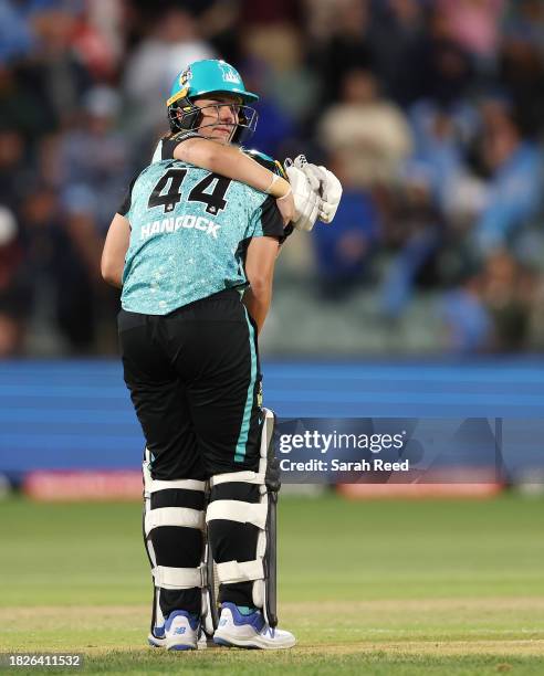 Jess Kerr of the Brisbane Heat and Nicola Hancock of the Brisbane Heat console each other after the loss during the WBBL Final match between Adelaide...