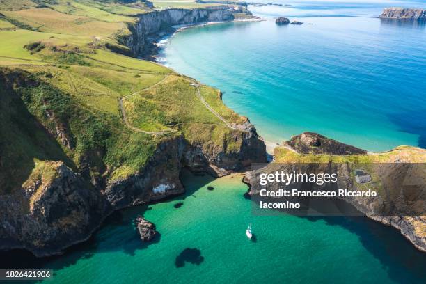 the emerald isle, ireland. aerial drone view - hanging bridge stock pictures, royalty-free photos & images