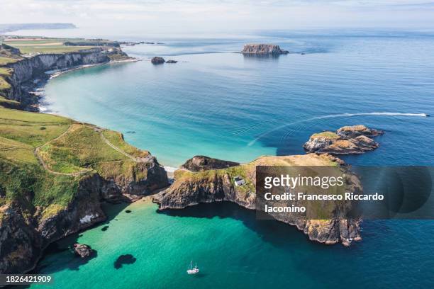 the emerald isle, ireland. aerial drone view - hanging bridge stock pictures, royalty-free photos & images