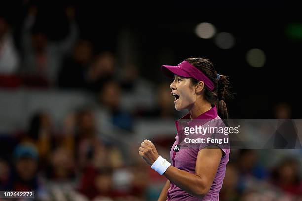 Li Na of China celebrates winning against Sabine Lisicki of Germany during her women's singles match on day five of the 2013 China Open at the...