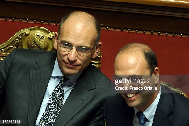Prime Minister Enrico Letta and Deputy Prime Minister and Interior Minister Angelino Alfano smile after gaining the confidence vote for their...