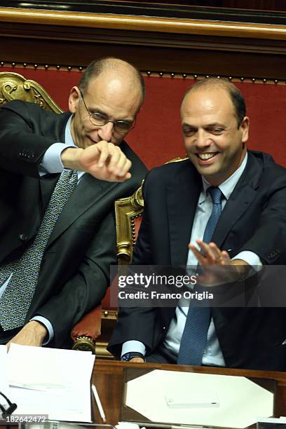 Prime Minister Enrico Letta and Deputy Prime Minister and Interior Minister Angelino Alfano smile and wave after gaining the confidence vote for...