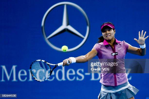 Li Na of China returns a ball to Sabine Lisicki of Germany on day five of the 2013 China Open at National Tennis Center on October 2, 2013 in...