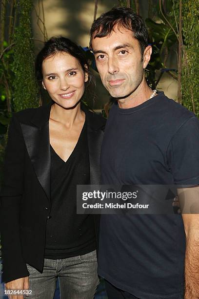 Virginie Ledoyen and Giambattista Valli attend the Moncler Gamme Rouge show as part of the Paris Fashion Week Womenswear Spring/Summer 2014 on...