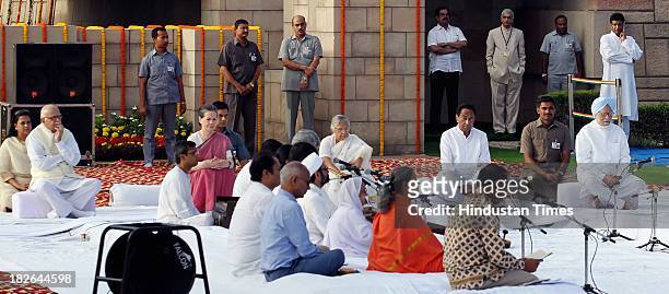 Prime Minister Manmohan Singh and UPA Chairperson and Congress President Sonia Gandhi and BJP Senior leader L K Advani paying homage to the Father of...