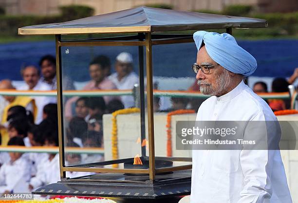 Prime Minister Manmohan Singh paying homage to the Father of the Nation Mahatma Gandhi on the occasion of his 144th birth anniversary at his memorial...