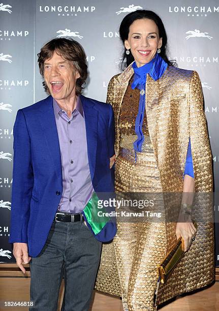 Wren Scott and Mick Jagger attend the grand opening party of Longchamp Regent Streetat Longchamp on September 14, 2013 in London, England.