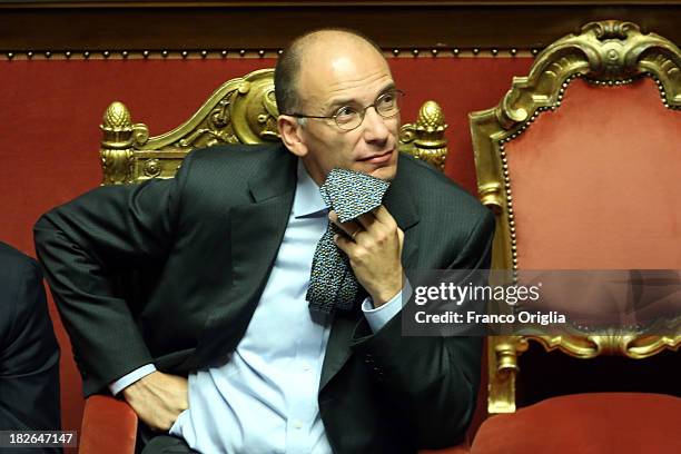 Prime Minister Enrico Letta plays with his tie as he attends the confidence vote for his government at the Italian Senate, Palazzo Madama on October...