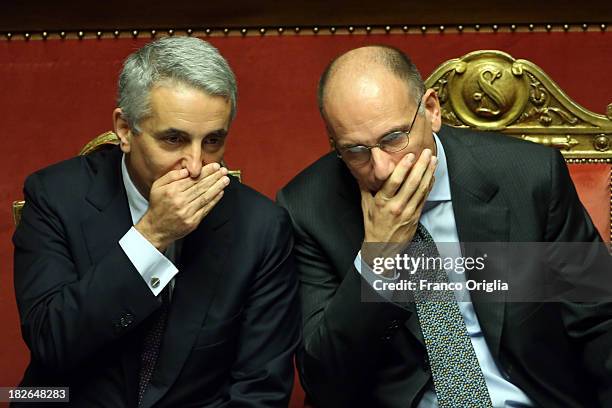 Prime Minister Enrico Letta and Minister Gaetano Quagliariello chat during the confidence vote for their government at the Italian Senate, Palazzo...