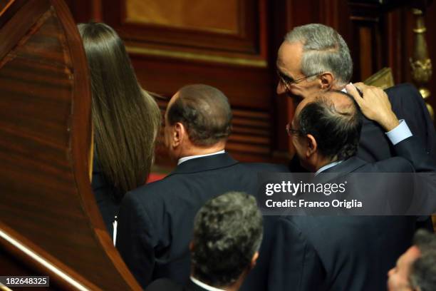 Former Prime Minister Silvio Berlusconi leaves after the confidence vote for Enrico Letta's government at the Italian Senate, Palazzo Madama on...