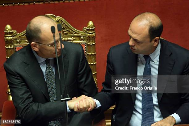 Prime Minister Enrico Letta and Deputy Prime Minister and Interior Minister Angelino Alfano shake hands during the confidence vote for their...