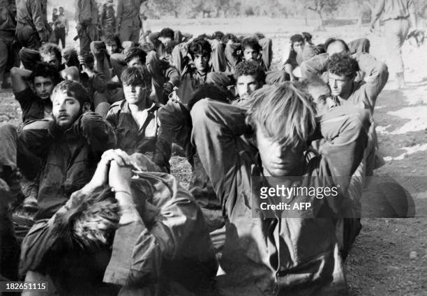 Israeli officers prisoners captured by Syrian troops on the Golan front sit on October 16, 1973 in the Damas area during the 1973 Arab-Israeli War....