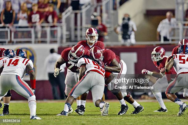 Alabama Cyrus Kouandjio and Arie Kouandjio in action, double team block to protect QB A.J. McCarron vs Mississippi Bryon Bennett at Bryant-Denny...