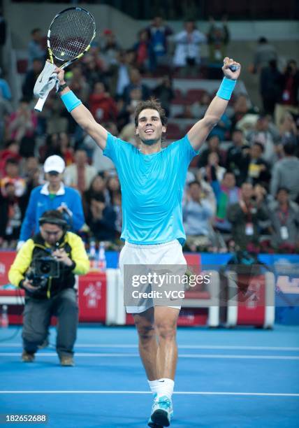 Rafael Nadal of Spain celebrates after defeating Philipp Kohlschreiber of Germany on day five of the 2013 China Open at National Tennis Center on...