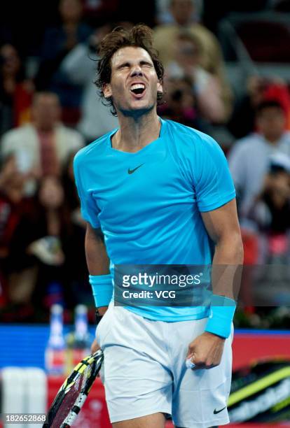 Rafael Nadal of Spain celebrates after defeating Philipp Kohlschreiber of Germany on day five of the 2013 China Open at National Tennis Center on...