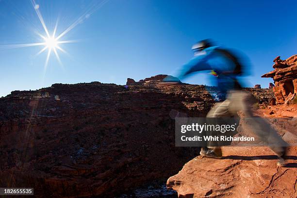 a person about to jump off a cliff. - base jumping stock pictures, royalty-free photos & images