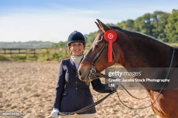 caucasian girl and horse winning equestrian competition - reins stock pictures, royalty-free photos & images
