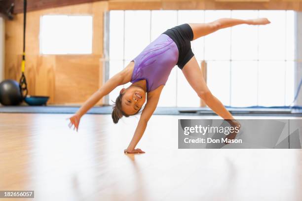 chinese girl practicing gymnastics - kids gymnastics stock pictures, royalty-free photos & images