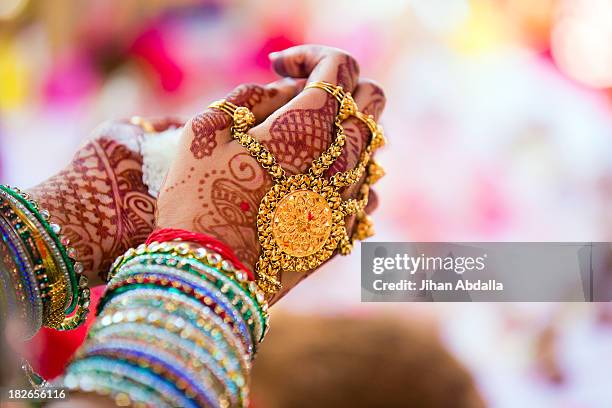 close up of hands with intricate henna design - tatuagem de henna imagens e fotografias de stock