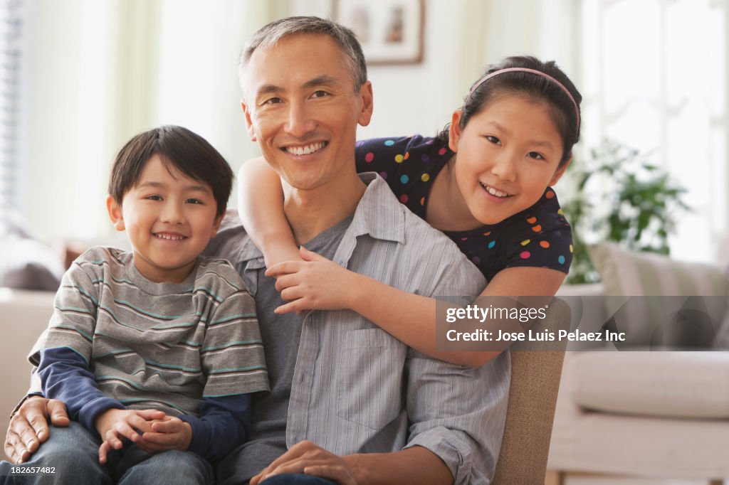 Father and children smiling together