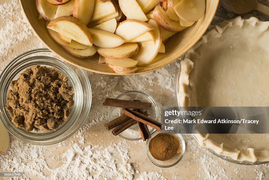 Close Up Of Apples Spices And Empty Pie Shell Photo - Getty Images