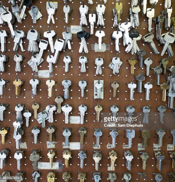 racks of keys on wall - large group of objects stock pictures, royalty-free photos & images