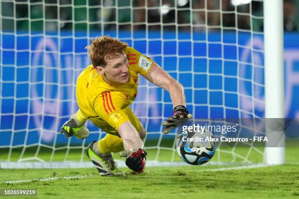 Konstantin Heide of Germany saves the penalty of Bastien Meupiyou of France during the FIFA U-17 World Cup Final match between Germany and France at...