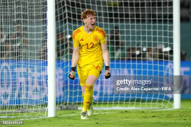 Konstantin Heide of Germany celebrates after saving the penalty of Tidiam Gomis of France during the FIFA U-17 World Cup Final match between Germany...