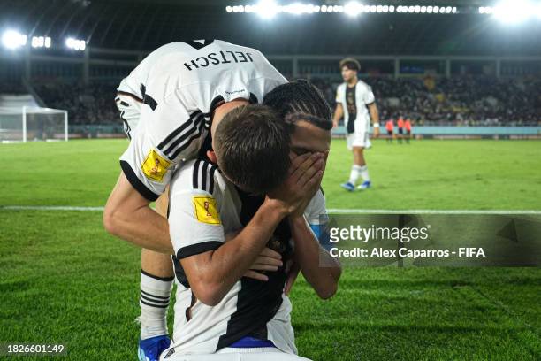 Paris Brunner and Finn Jeltsch of Germany celebrate victory in the penalty shoot out following the FIFA U-17 World Cup Final match between Germany...