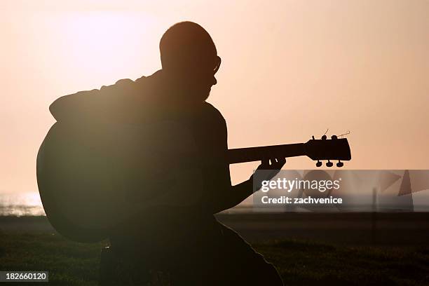 beach guitarist - guitar player silhouette stock pictures, royalty-free photos & images