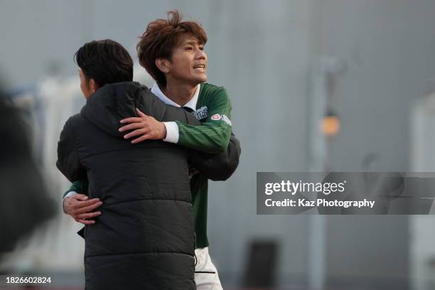 Yosuke Kashiwagi of FC Gifu hugs with the coach of FC Gifu after the substitution after his last game played during the J.LEAGUE Meiji Yasuda J3 38th...