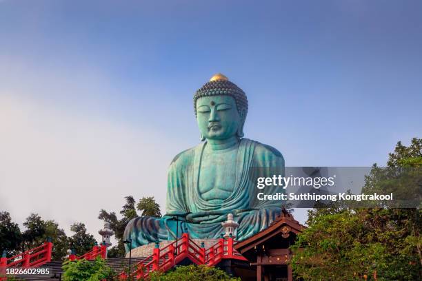 famous big buddha statue inside wat phra that doi phra chan temple. great buddha. the ornate temple stairs. the most important travel destination in lampang - buddha stock pictures, royalty-free photos & images