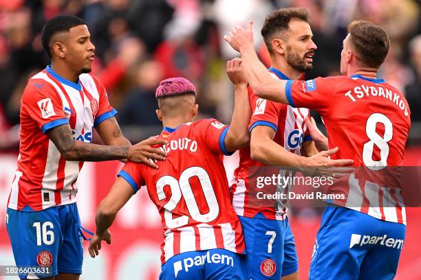 Cristhian Stuani of Girona FC celebrates with teammates after scoring the team's first goal during the LaLiga EA Sports match between Girona FC and...