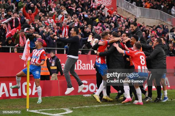 Cristhian Stuani of Girona FC celebrates with teammates after scoring the team's second goal during the LaLiga EA Sports match between Girona FC and...