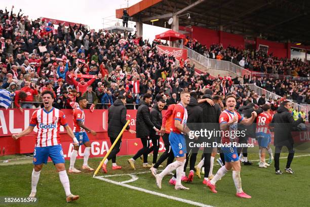 Cristhian Stuani of Girona FC celebrates with teammates after scoring the team's second goal during the LaLiga EA Sports match between Girona FC and...